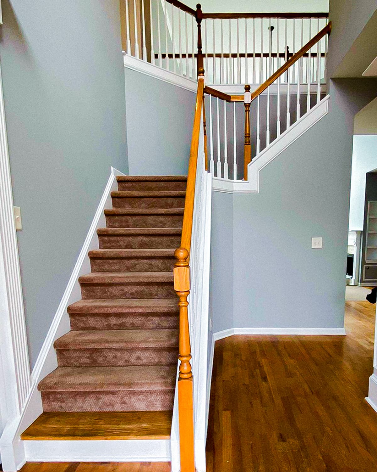 Interior staircase painting for an Alpharetta GA area home by ProFound Painting LLC